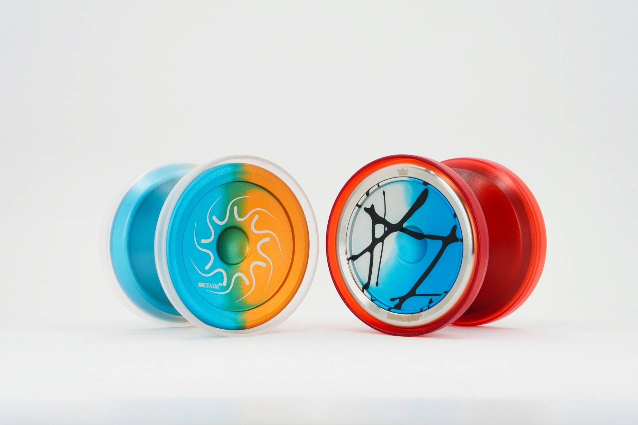 Close-up comparison of Nine Dragons and 99 Dragons free-spinning shell yo-yos