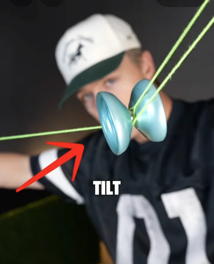 World champion demonstrating how to fix yo yo tilt, wobble, and sideways spin during string tricks