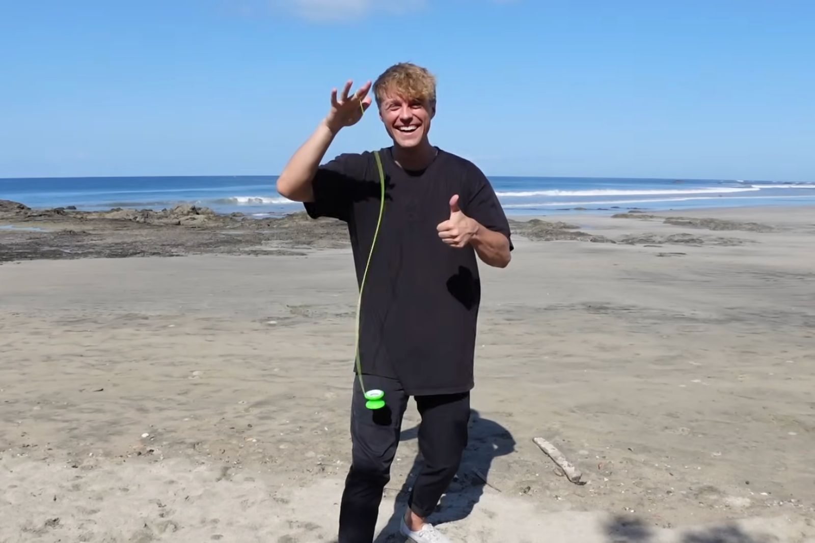 2x World Yo-Yo Champion Gentry Stein performing beginner DNA yo-yo trick on beach